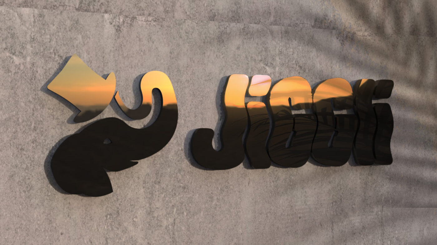 Desi the elephant mascot rendered in gold alongside the Jiggli wordmark
